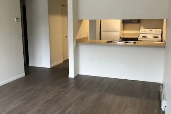 a view of a kitchen with a sink and a dishwasher