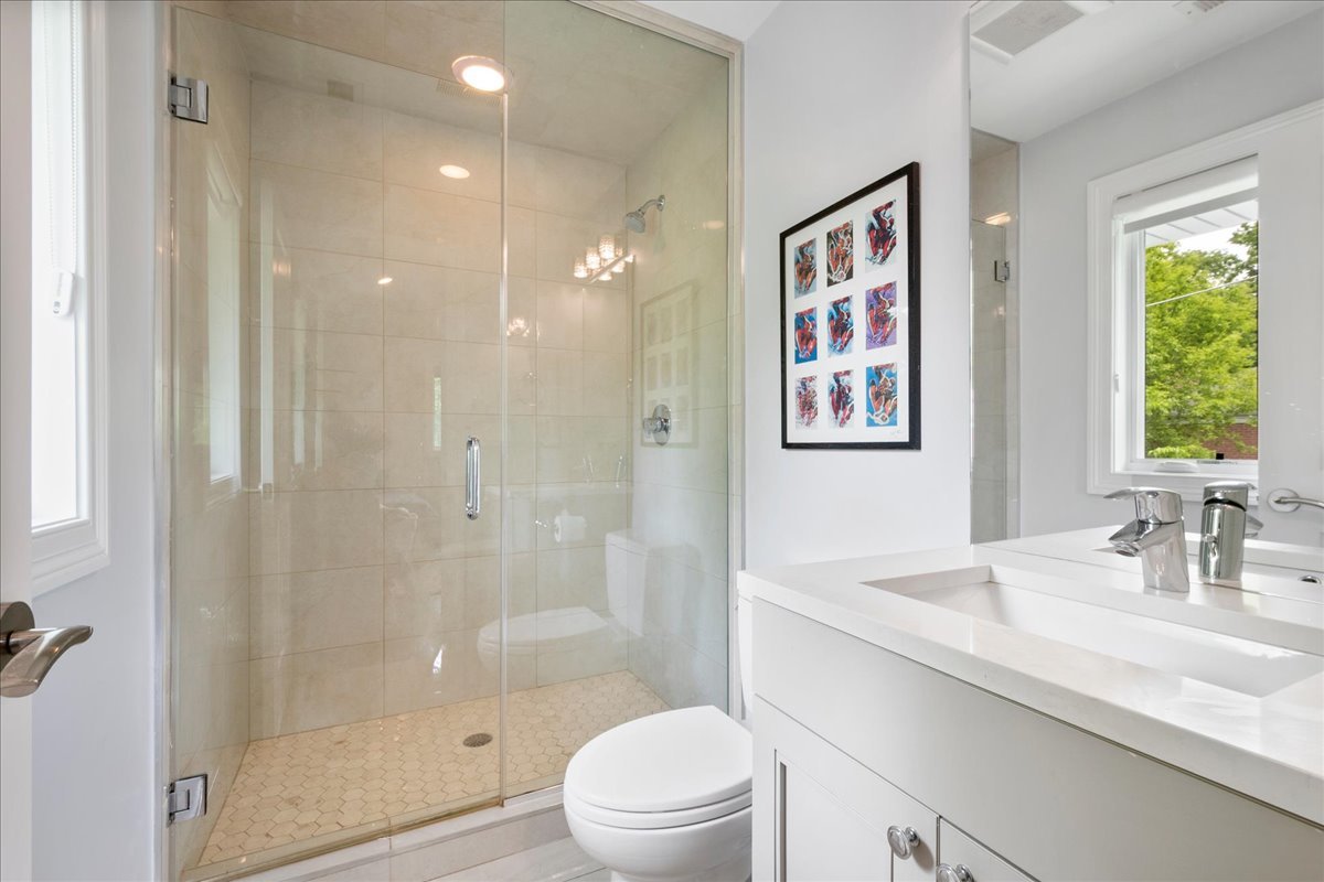 2921 Simpson Street Evanston, IL 60201 - Photo 23 of 41 a bathroom with a sink a toilet and shower