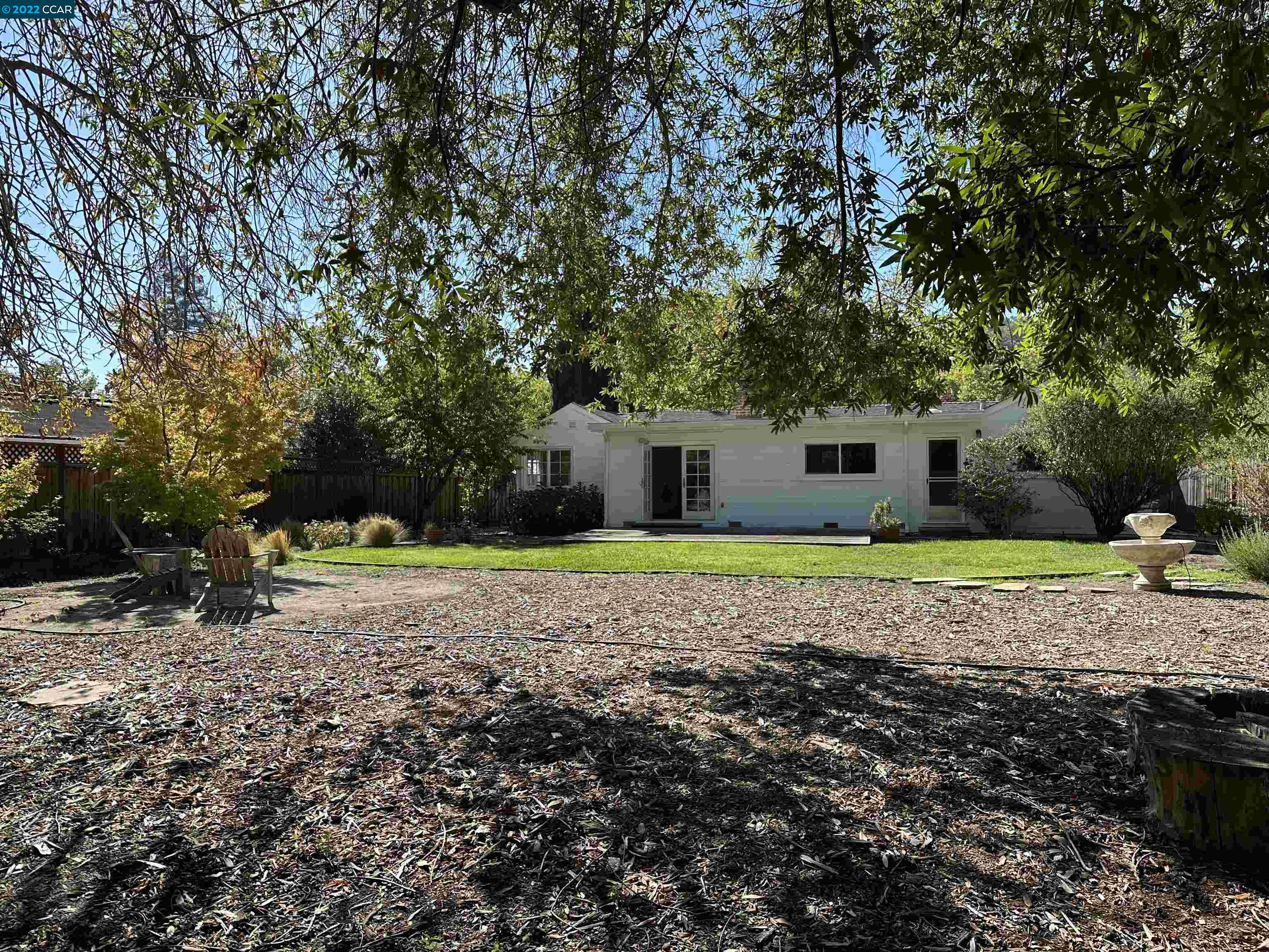 3360 Victoria Avenue Lafayette, CA 94549 - Photo 14 of 20 a view of a house with a yard and large trees
