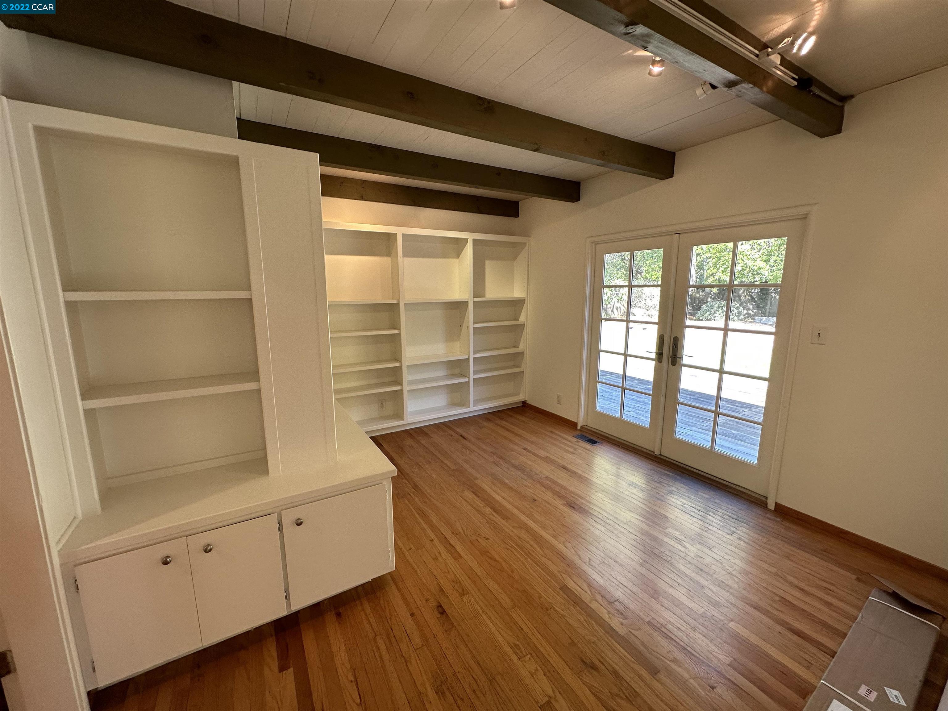 3360 Victoria Avenue Lafayette, CA 94549 - Photo 8 of 20 a view of an empty room with wooden floor and a window