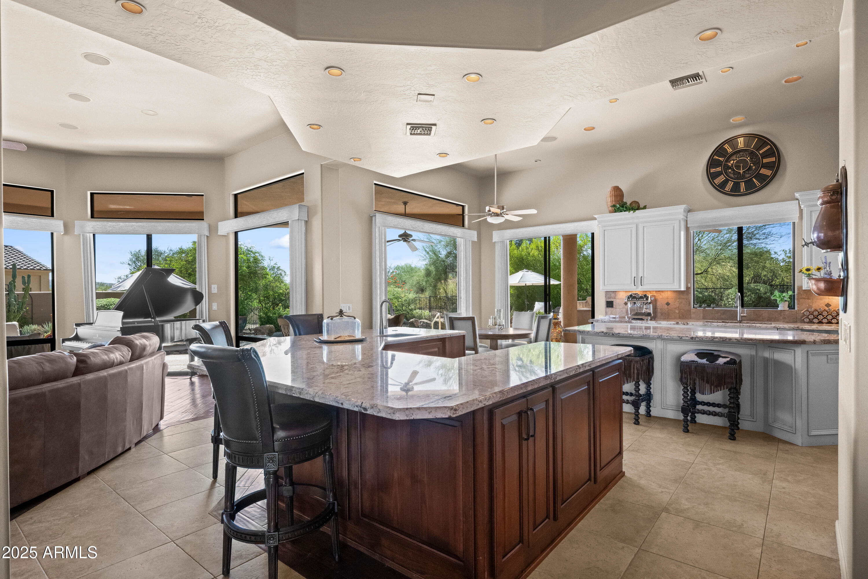 19007 East Lazo Court Rio Verde, AZ 85263 - Photo 14 of 58 a kitchen with sink a counter and chairs