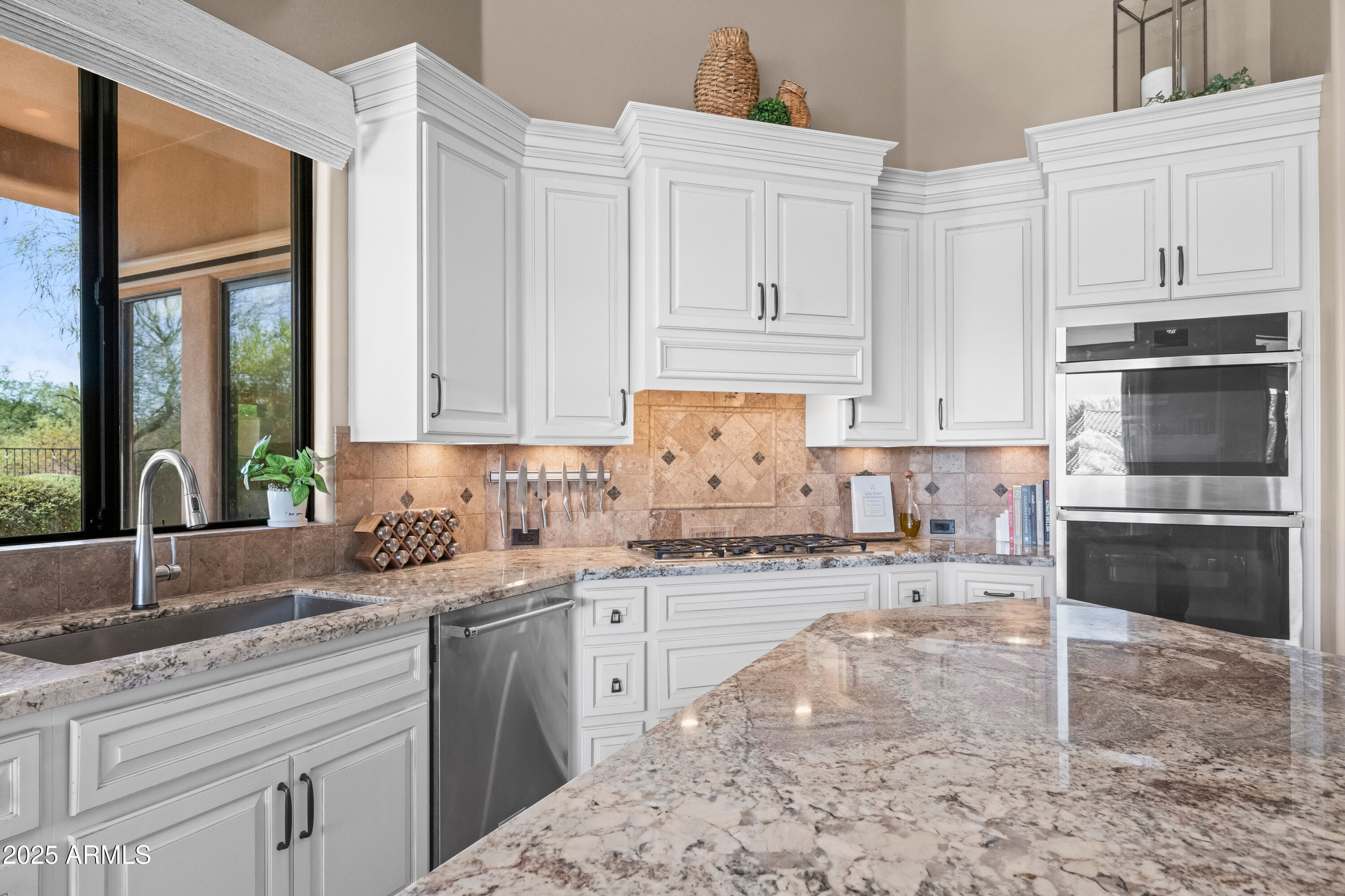 19007 East Lazo Court Rio Verde, AZ 85263 - Photo 18 of 58 a kitchen with granite countertop a sink stainless steel appliances and cabinets