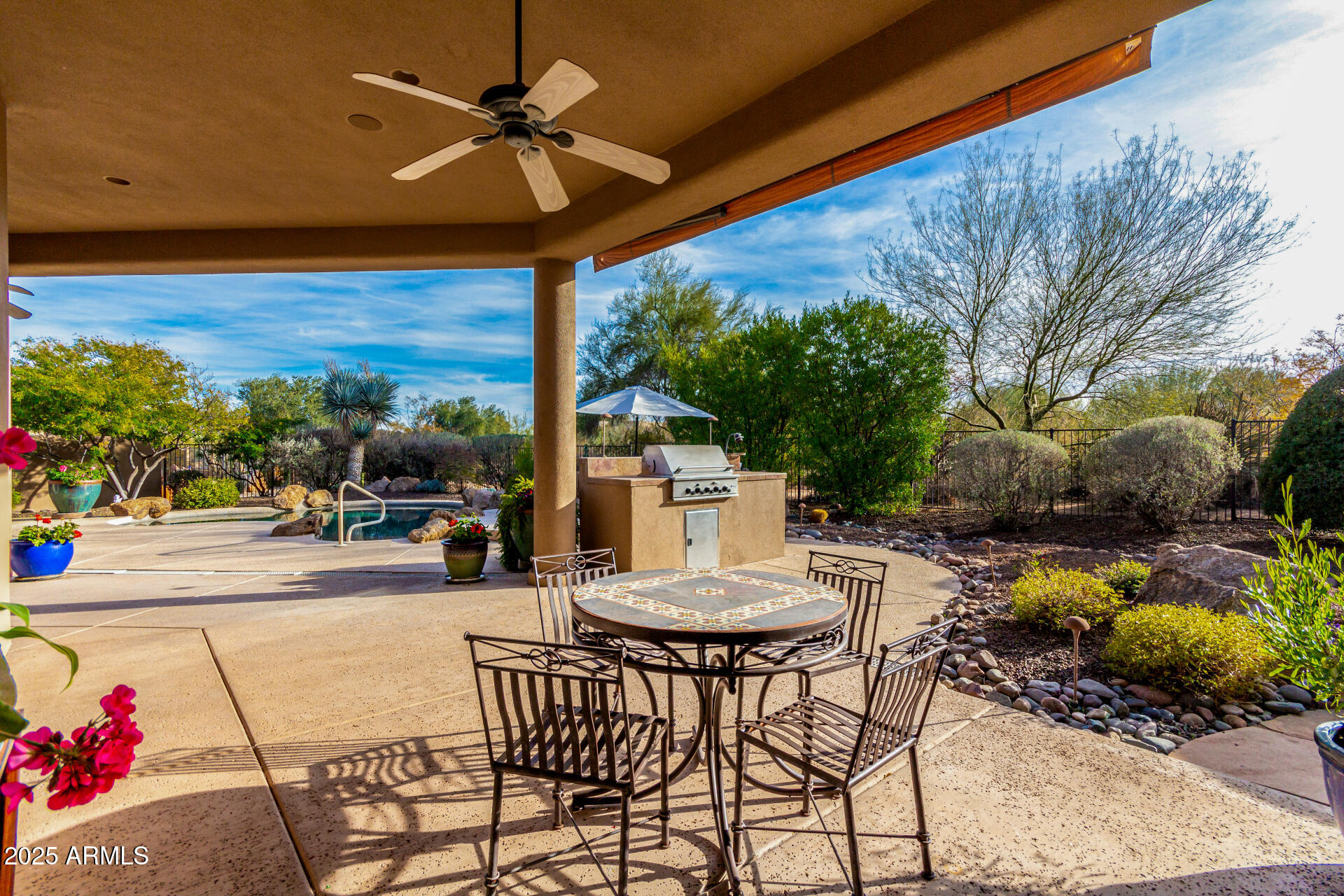 19007 East Lazo Court Rio Verde, AZ 85263 - Photo 41 of 58 a view of a patio with a table and chairs