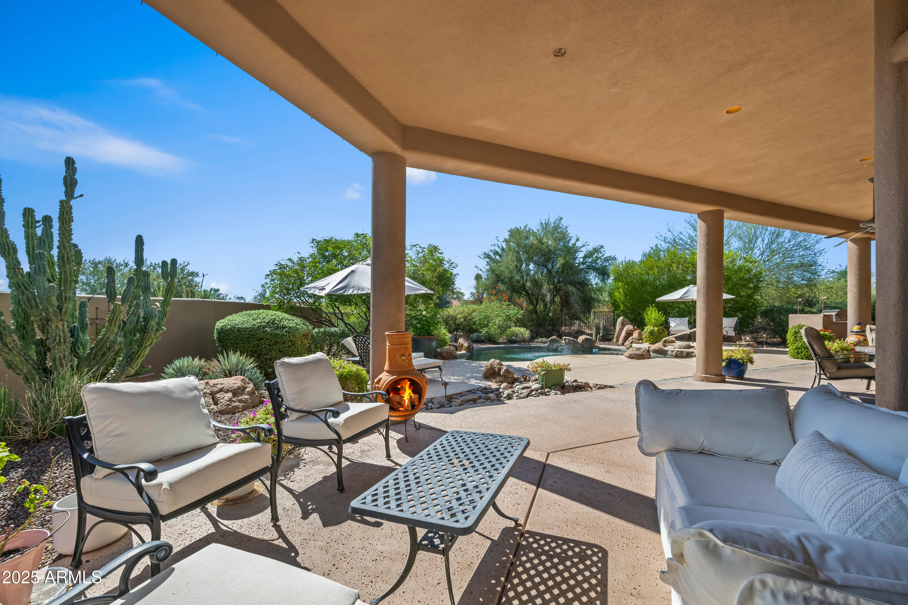 19007 East Lazo Court Rio Verde, AZ 85263 - Photo 47 of 58 a view of a patio with couches and chairs