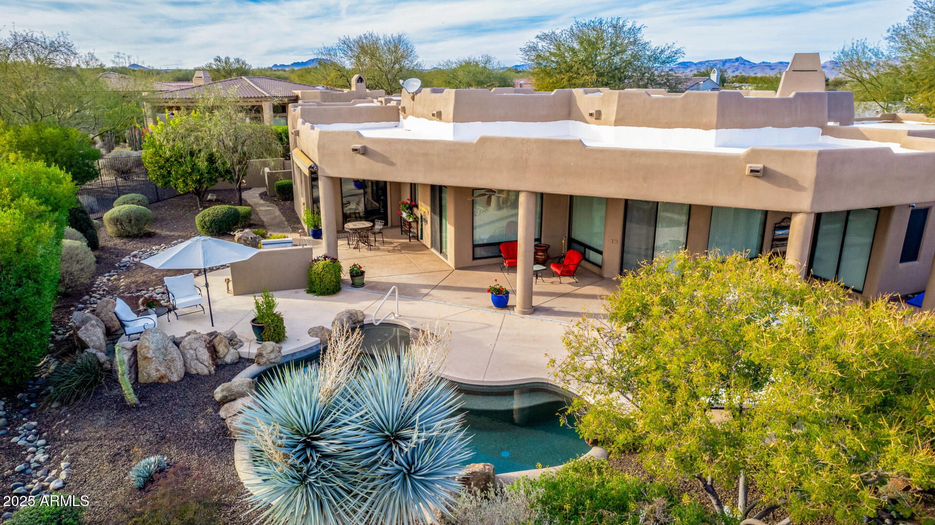 19007 East Lazo Court Rio Verde, AZ 85263 - Photo 49 of 58 a view of a swimming pool with outdoor seating