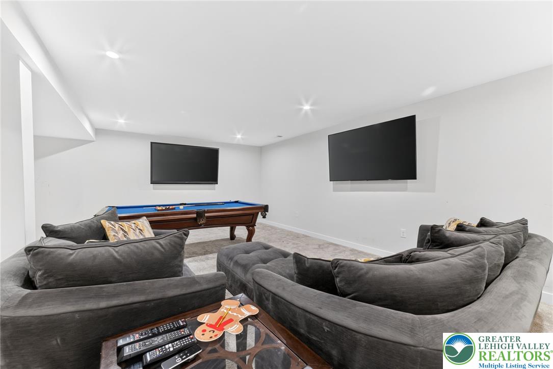 3952 Orth Street Bethlehem, PA 18020 - Photo 44 of 60 A versatile recreation room, ideal for entertaining, offers ample space for a billiards table and media viewing.