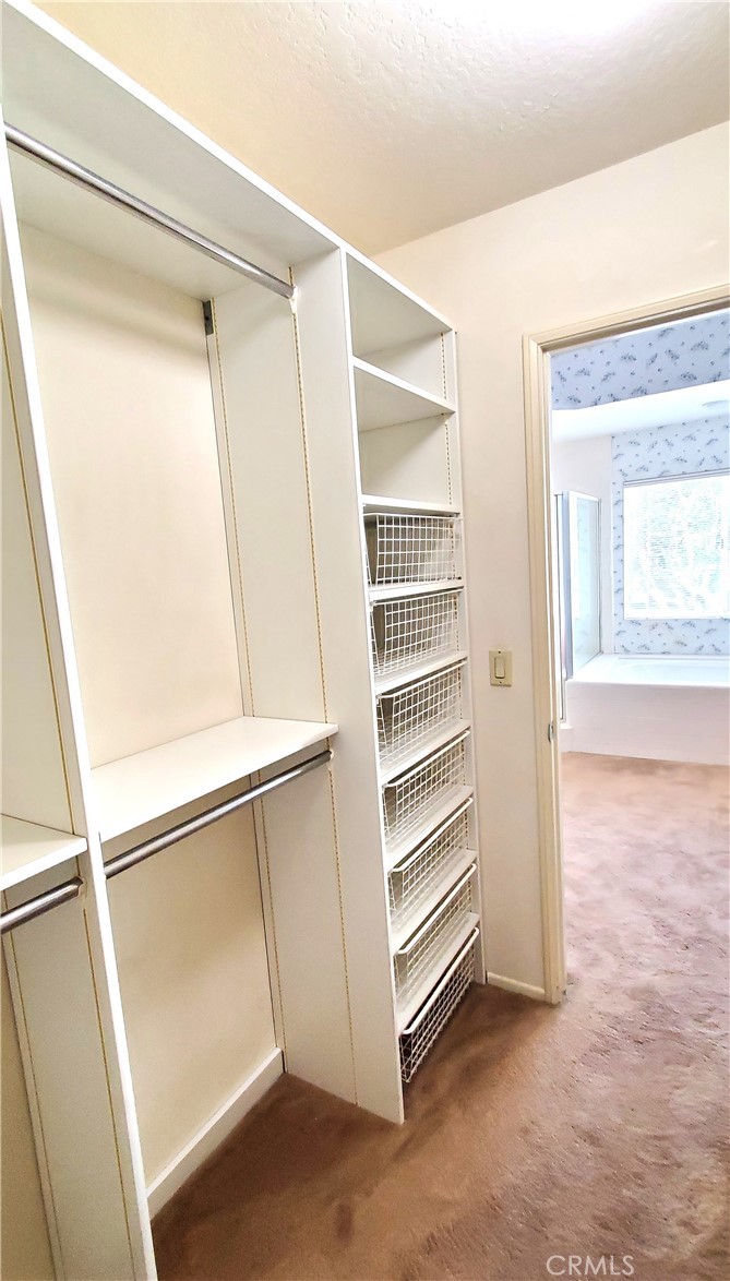 7 Del Rey, Unit 10 Irvine, CA 92612 - Photo 43 of 75 Primary Suite walk in closet with built in organizer
