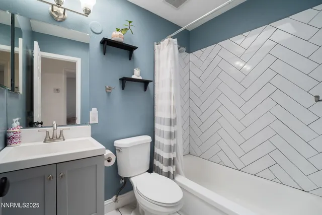 a bedroom with a bed and a potted plant