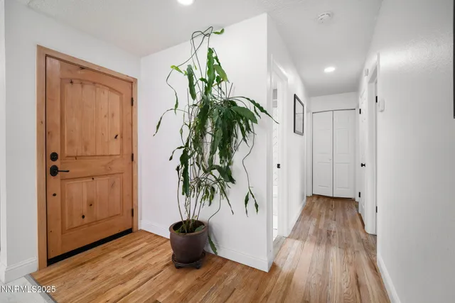 a view of entryway with wooden floor