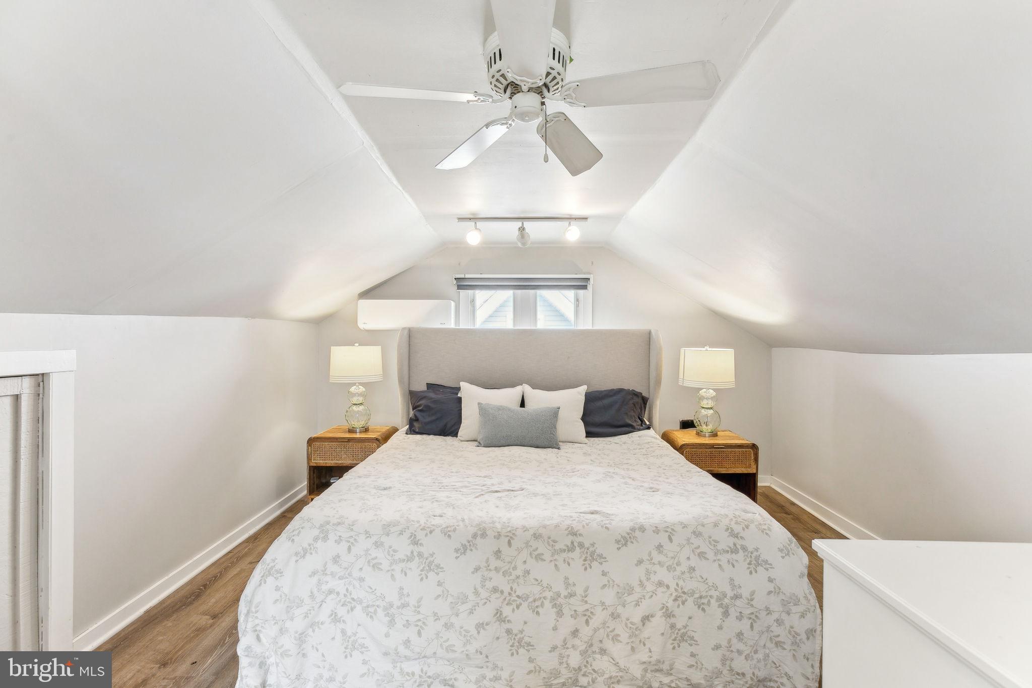 320 Kathmere Road Havertown, PA 19083 - Photo 23 of 48 a bedroom with a large bed and a chandelier