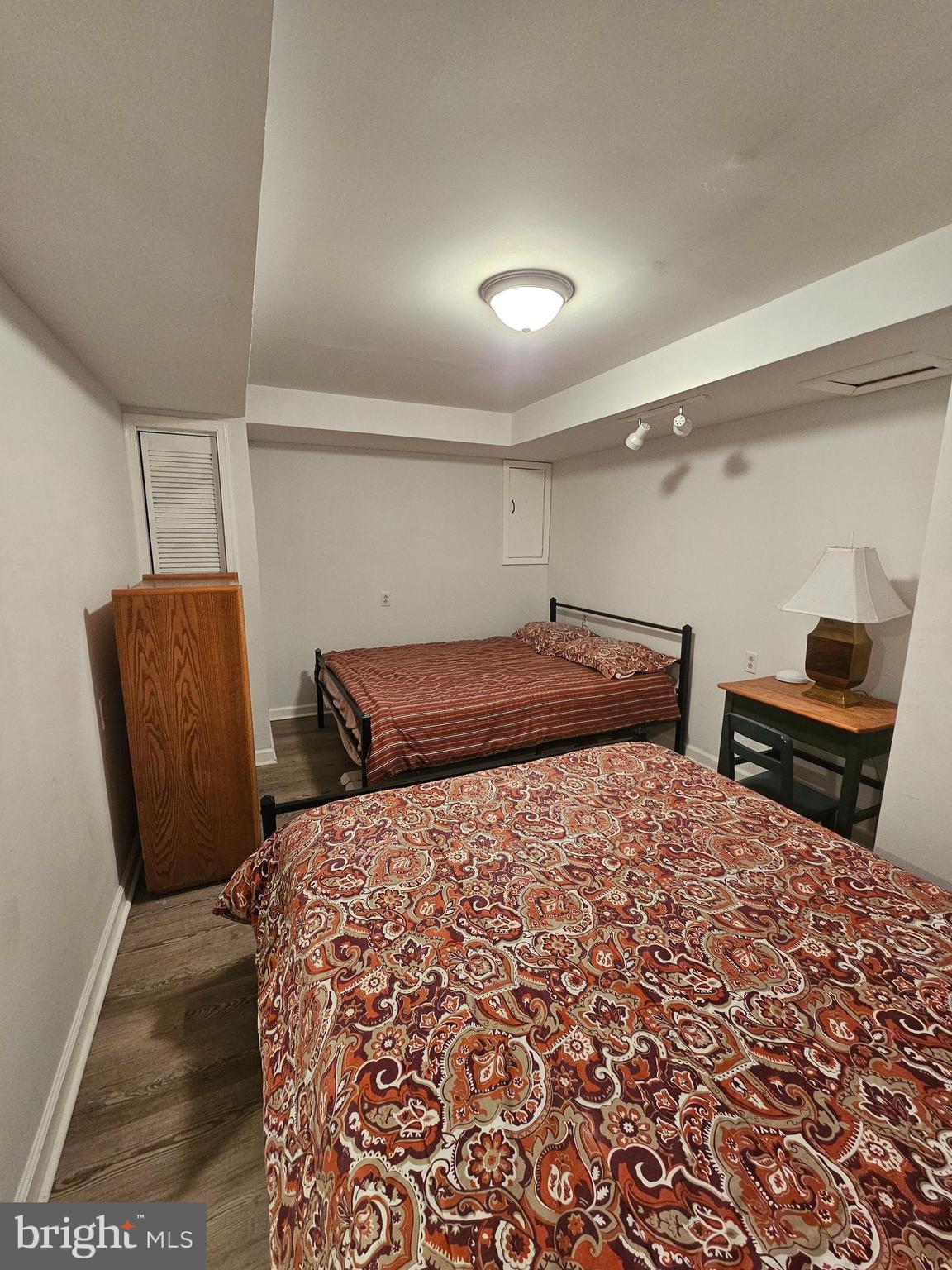 82 Basin Road Earleville, MD 21919 - Photo 14 of 46 a bedroom with a bed and wooden floor