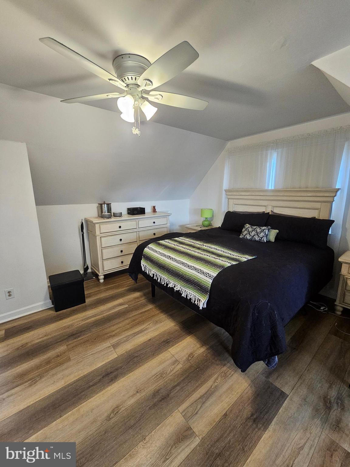 82 Basin Road Earleville, MD 21919 - Photo 39 of 46 a spacious bedroom with a bed and a chandelier