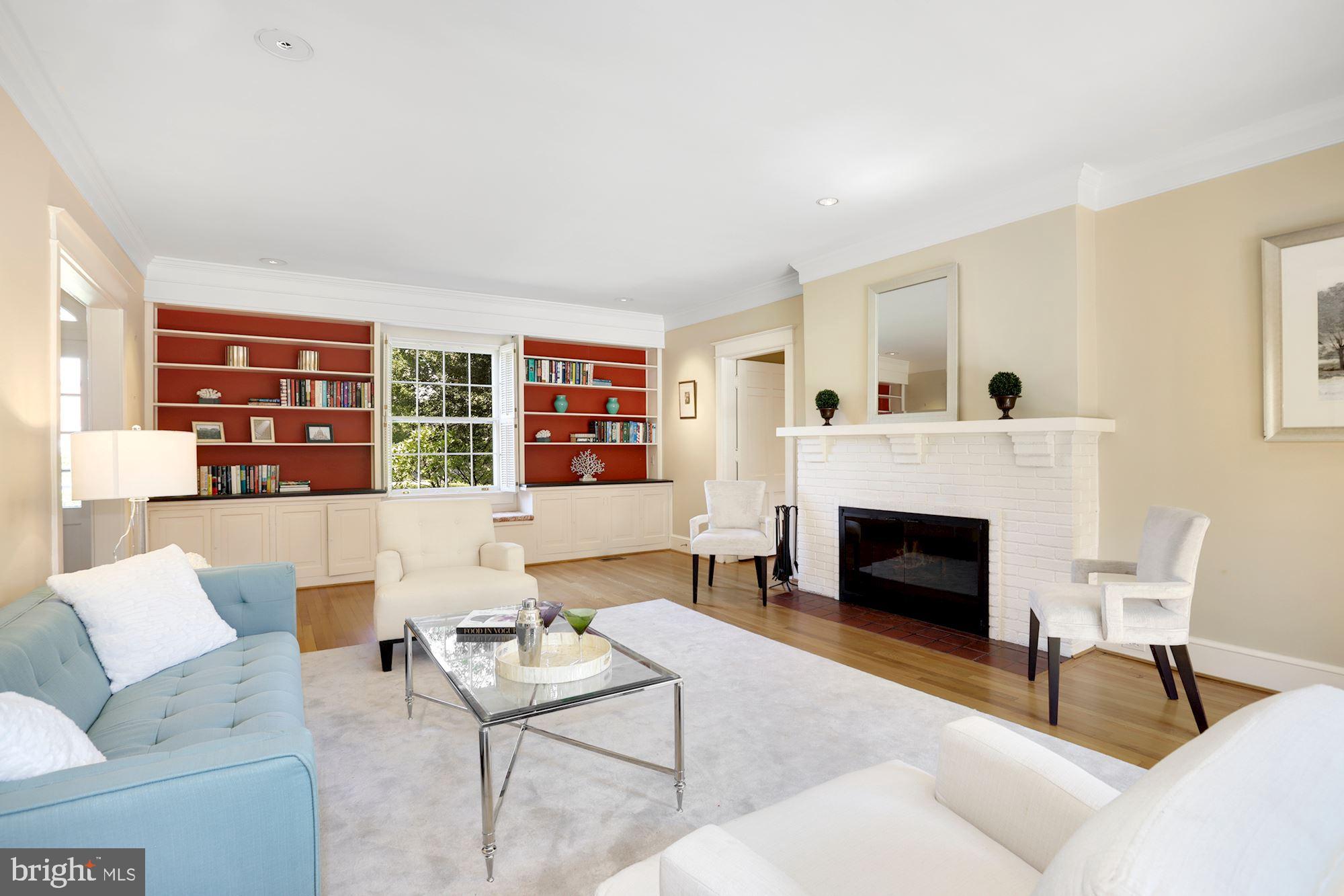 3720 Bradley Lane Chevy Chase, MD 20815 - Photo 13 of 29 a living room with furniture and a fireplace
