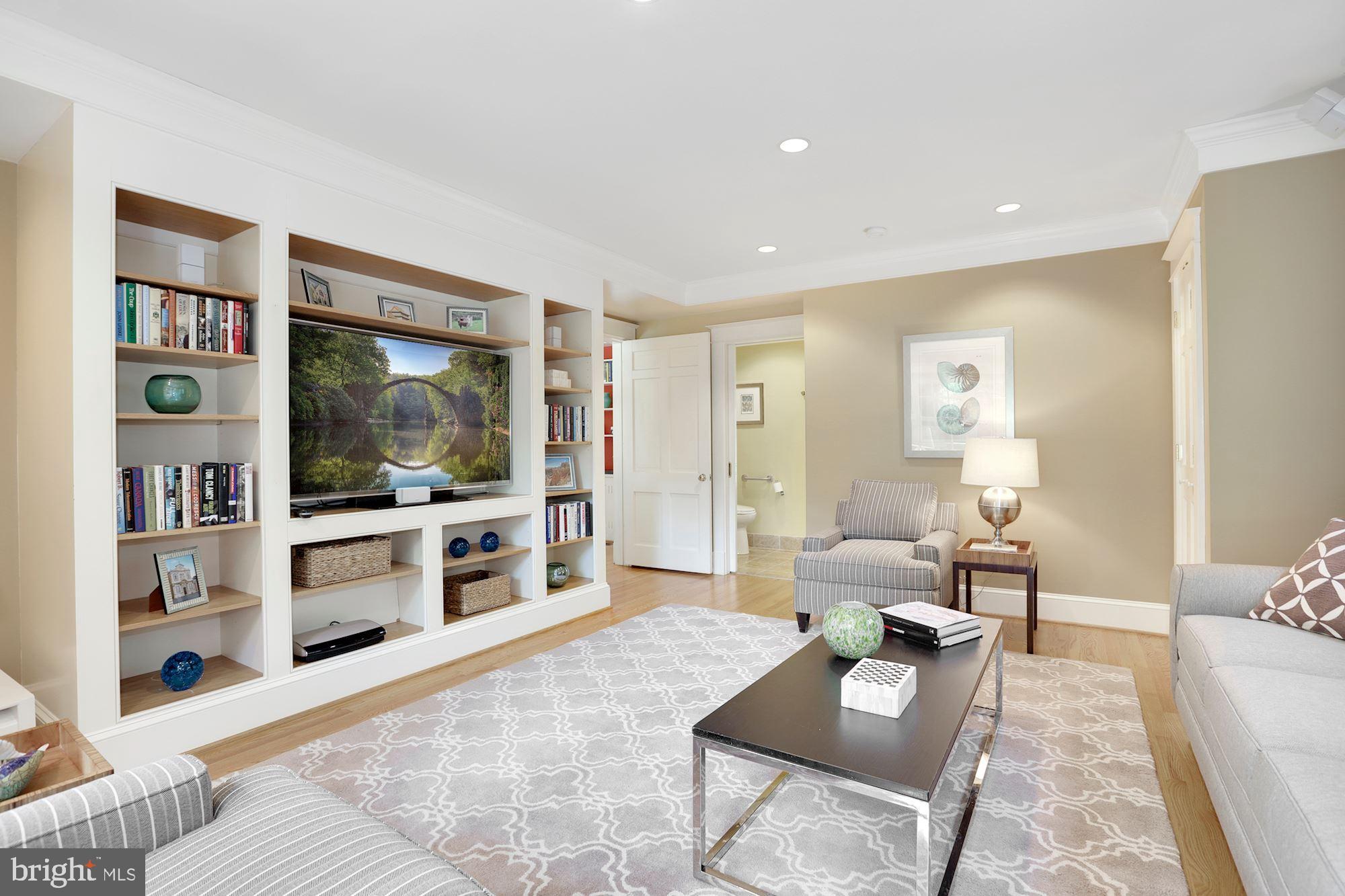 3720 Bradley Lane Chevy Chase, MD 20815 - Photo 15 of 29 a living room with furniture and a flat screen tv