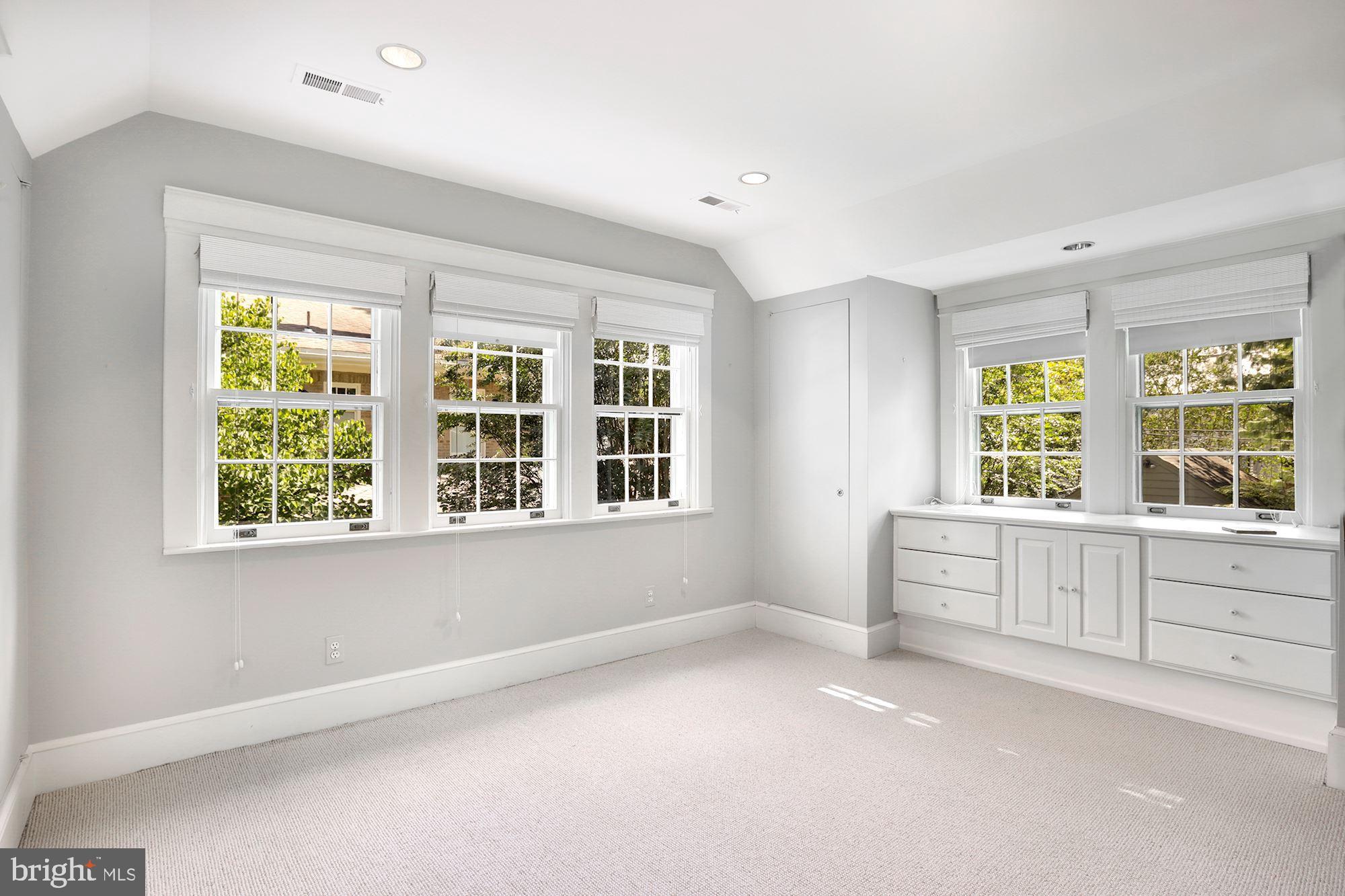 3720 Bradley Lane Chevy Chase, MD 20815 - Photo 18 of 29 a view of an empty room with a window