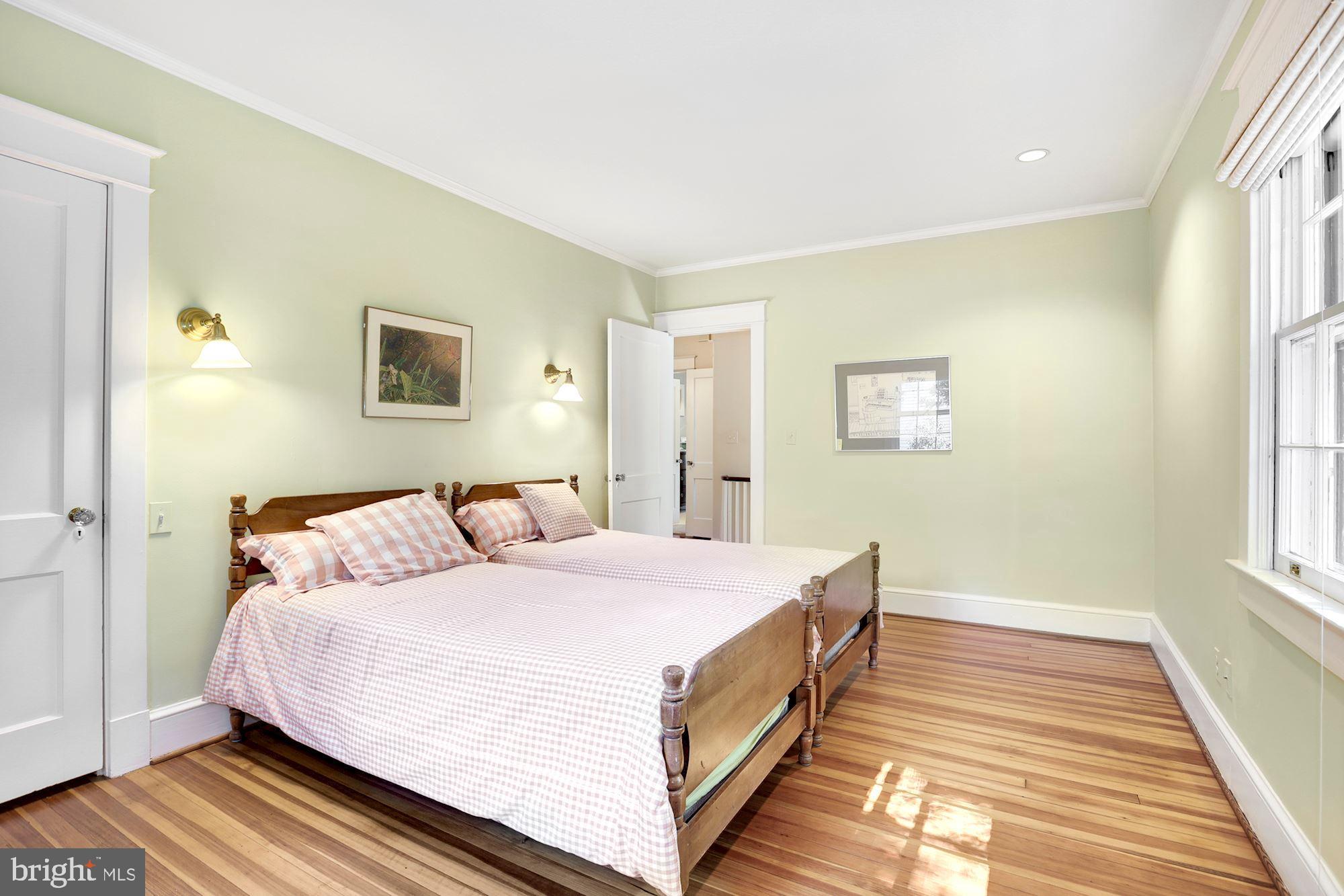 3720 Bradley Lane Chevy Chase, MD 20815 - Photo 21 of 29 a bedroom with a bed and a window