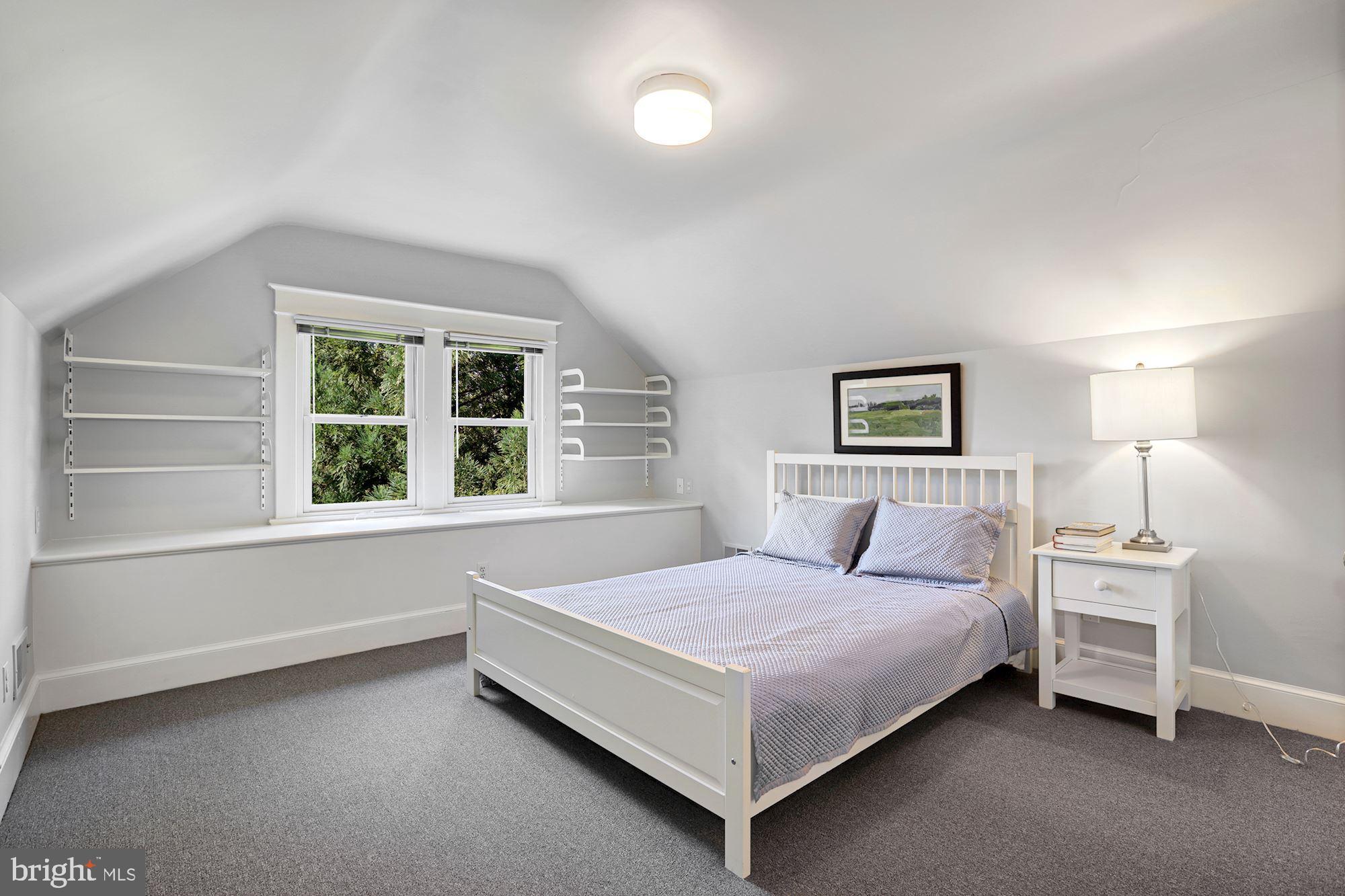 3720 Bradley Lane Chevy Chase, MD 20815 - Photo 24 of 29 a bedroom with a bed and a window