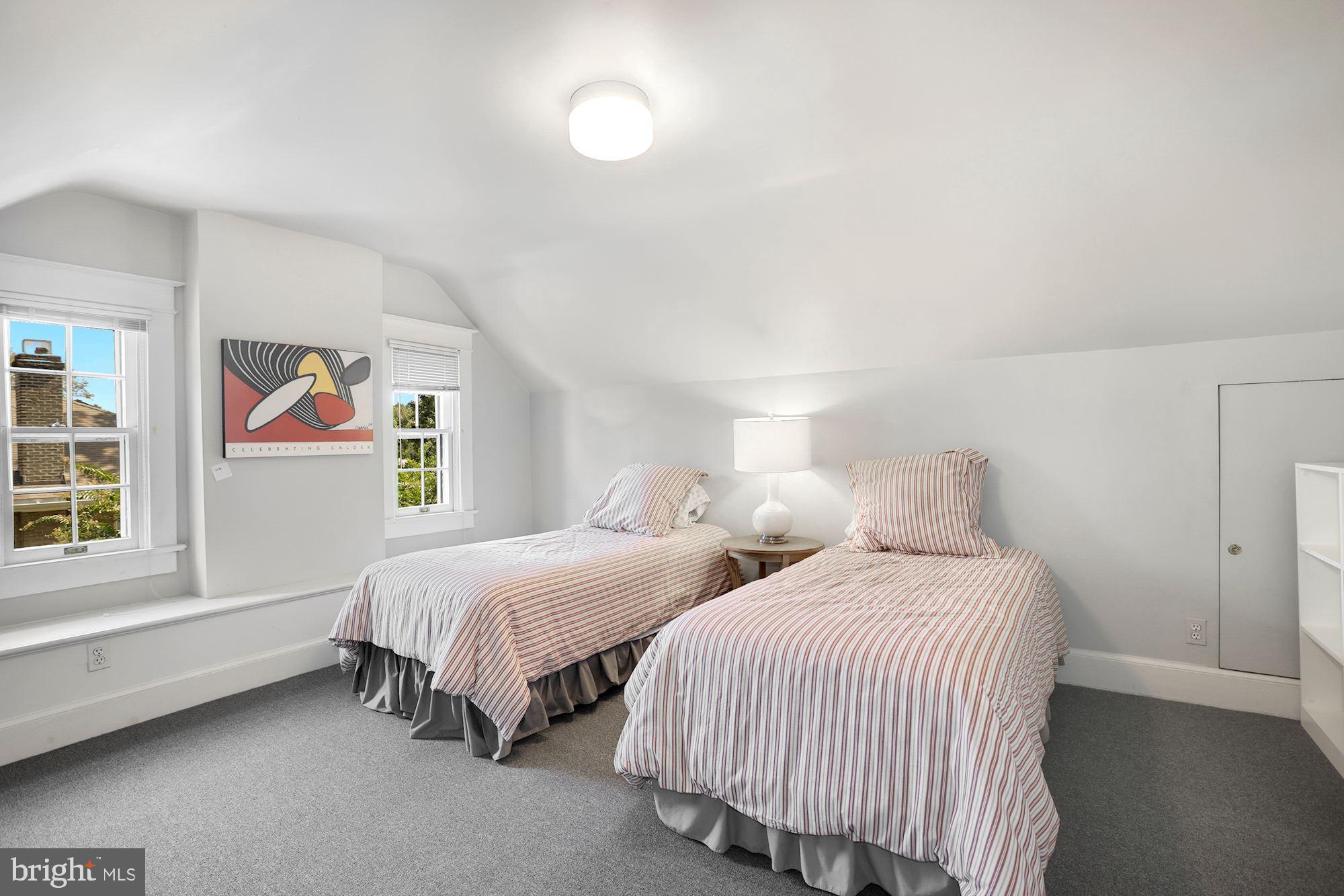 3720 Bradley Lane Chevy Chase, MD 20815 - Photo 26 of 29 a bedroom with two beds and a window