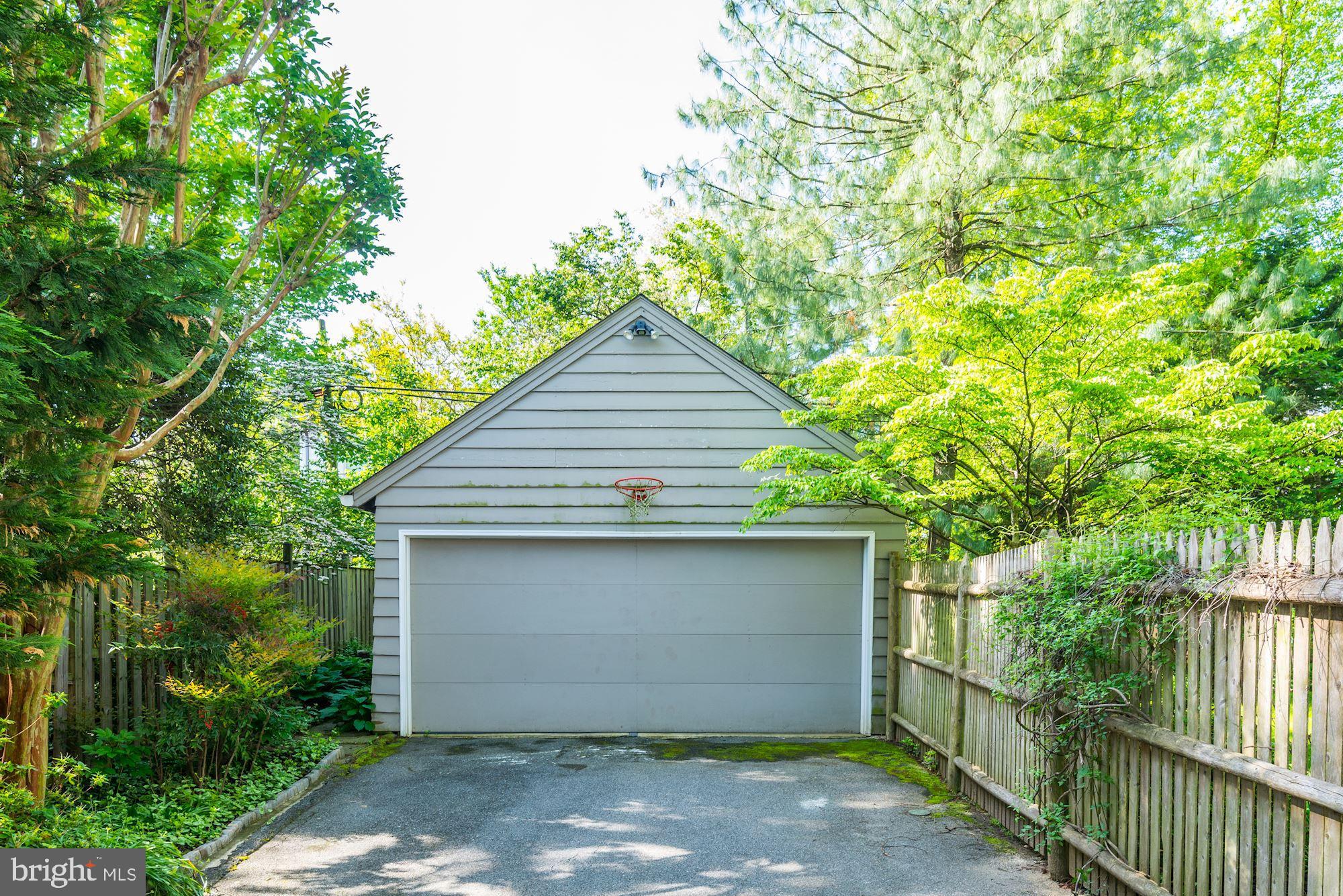3720 Bradley Lane Chevy Chase, MD 20815 - Photo 28 of 29 a front view of a house with garage