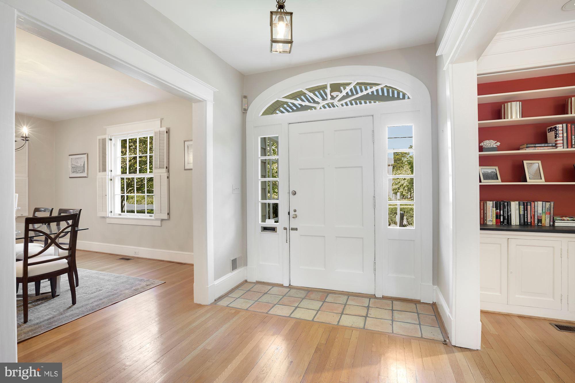 3720 Bradley Lane Chevy Chase, MD 20815 - Photo 7 of 29 wooden floor in an empty room with a window