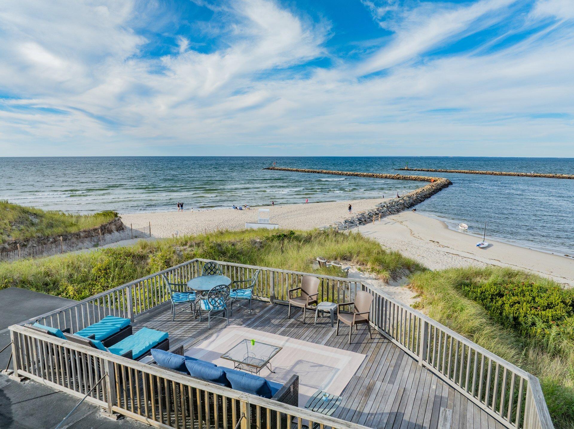 40 Harbor Road East Dennis, MA 02641 - Photo 4 of 32 a view of a balcony with ocean view