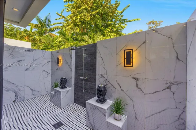 a view of walk in closet with clothes