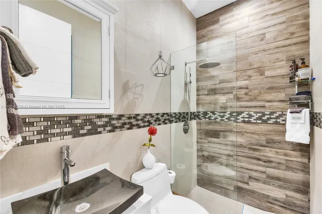 a wooden bench sitting in front of a building