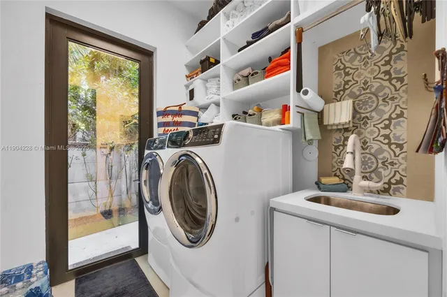 a view of a living room and kitchen