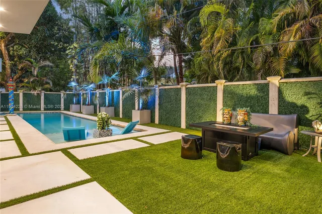 a view of backyard with large tree