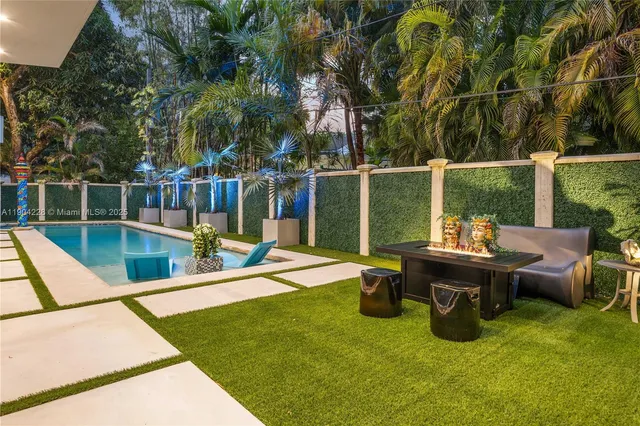 a picture of a bench in front of a gate