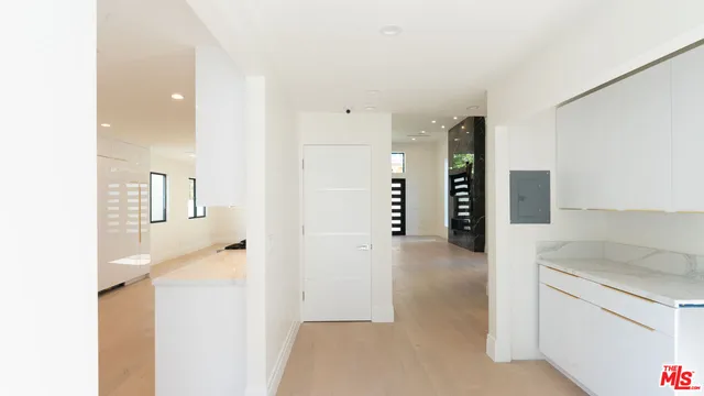 a view of a kitchen cabinets and a utility room
