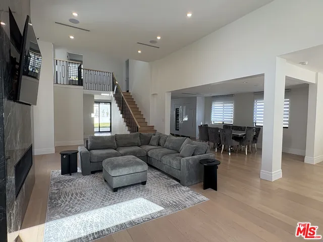 a bedroom with a bed and a view of kitchen