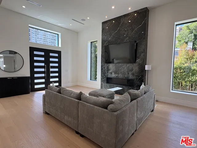 a bedroom with a bed and a desk in it