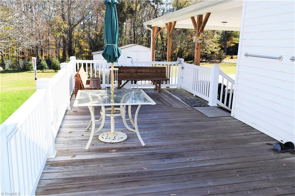758 Stokesburg Road Walnut Cove, NC 27052 - Photo 17 of 19 Deck with steps to carport