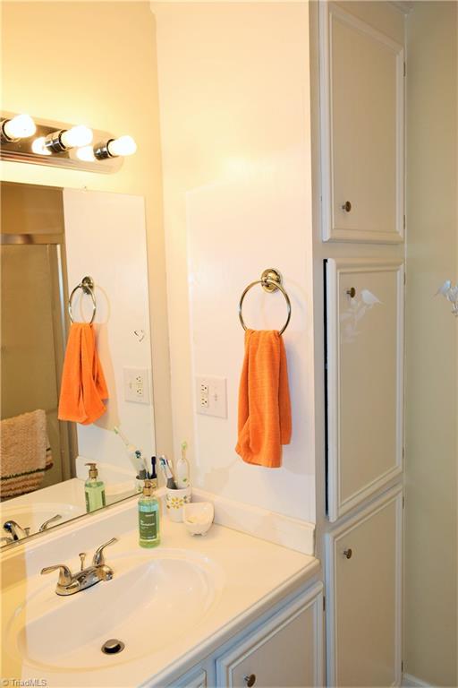 758 Stokesburg Road Walnut Cove, NC 27052 - Photo 10 of 19 Bathroom with built-in cabinets