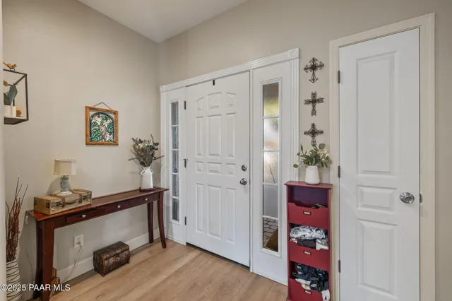a view of a room with wooden floor and closet