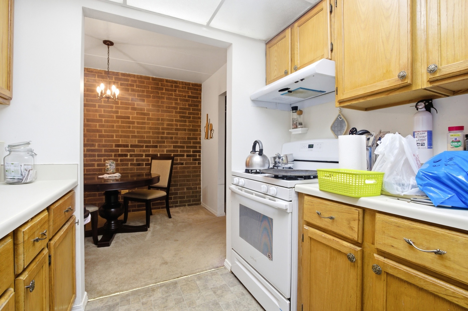 154 East Bailey Road, Unit D Naperville, IL 60565 - Photo 8 of 20 a kitchen with stainless steel appliances granite countertop a sink stove and cabinets