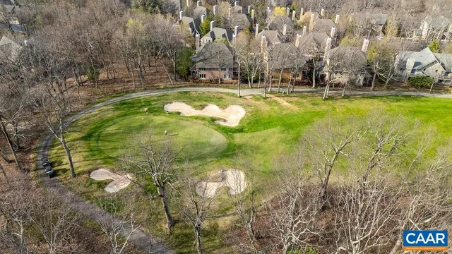 a swimming pool with trees in the background