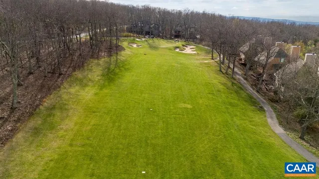 a swimming pool with trees in the background
