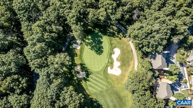 a view of a street with lots of green space