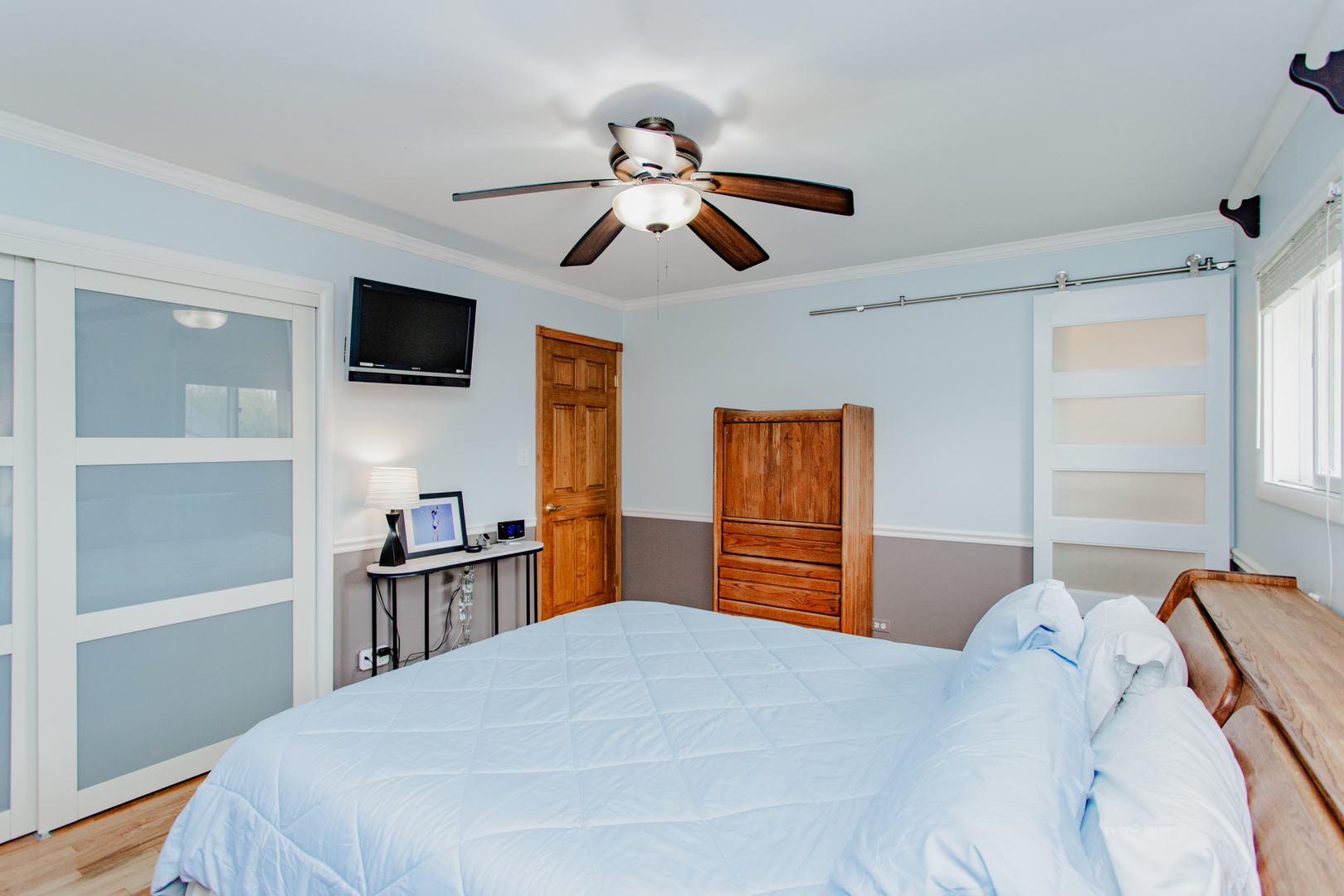 1685 Kent Road Hoffman Estates, IL 60169 - Photo 12 of 31 a bedroom with a bed and a flat screen tv