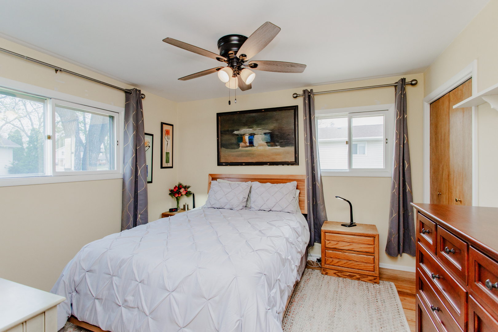 1685 Kent Road Hoffman Estates, IL 60169 - Photo 14 of 31 a bed room with a bed and a chandelier