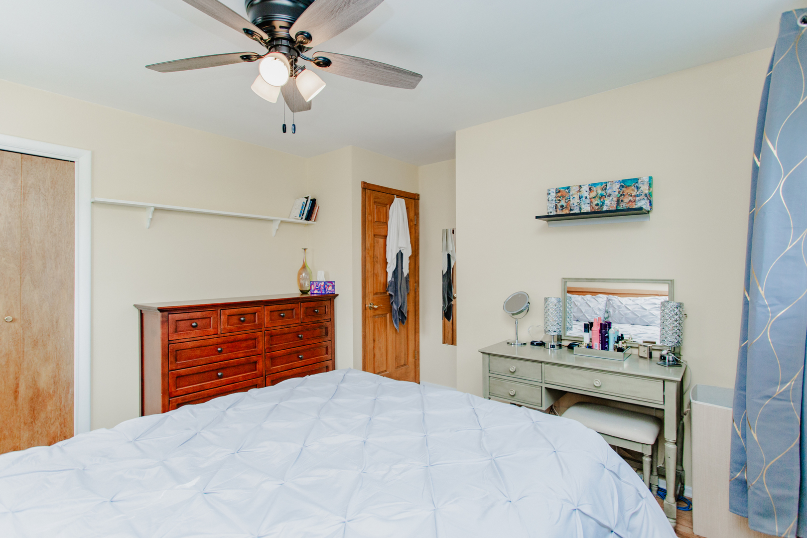 1685 Kent Road Hoffman Estates, IL 60169 - Photo 15 of 31 a bedroom with a bed and a chandelier