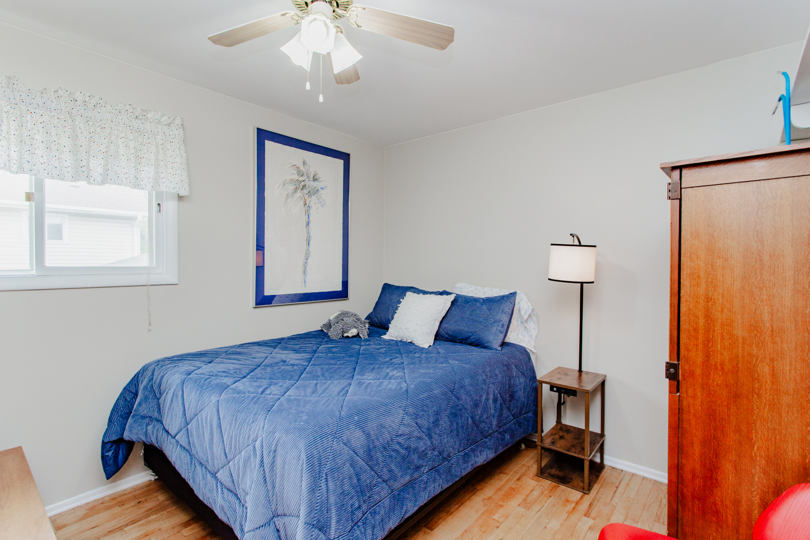 1685 Kent Road Hoffman Estates, IL 60169 - Photo 16 of 31 a bedroom with a bed and a chandelier