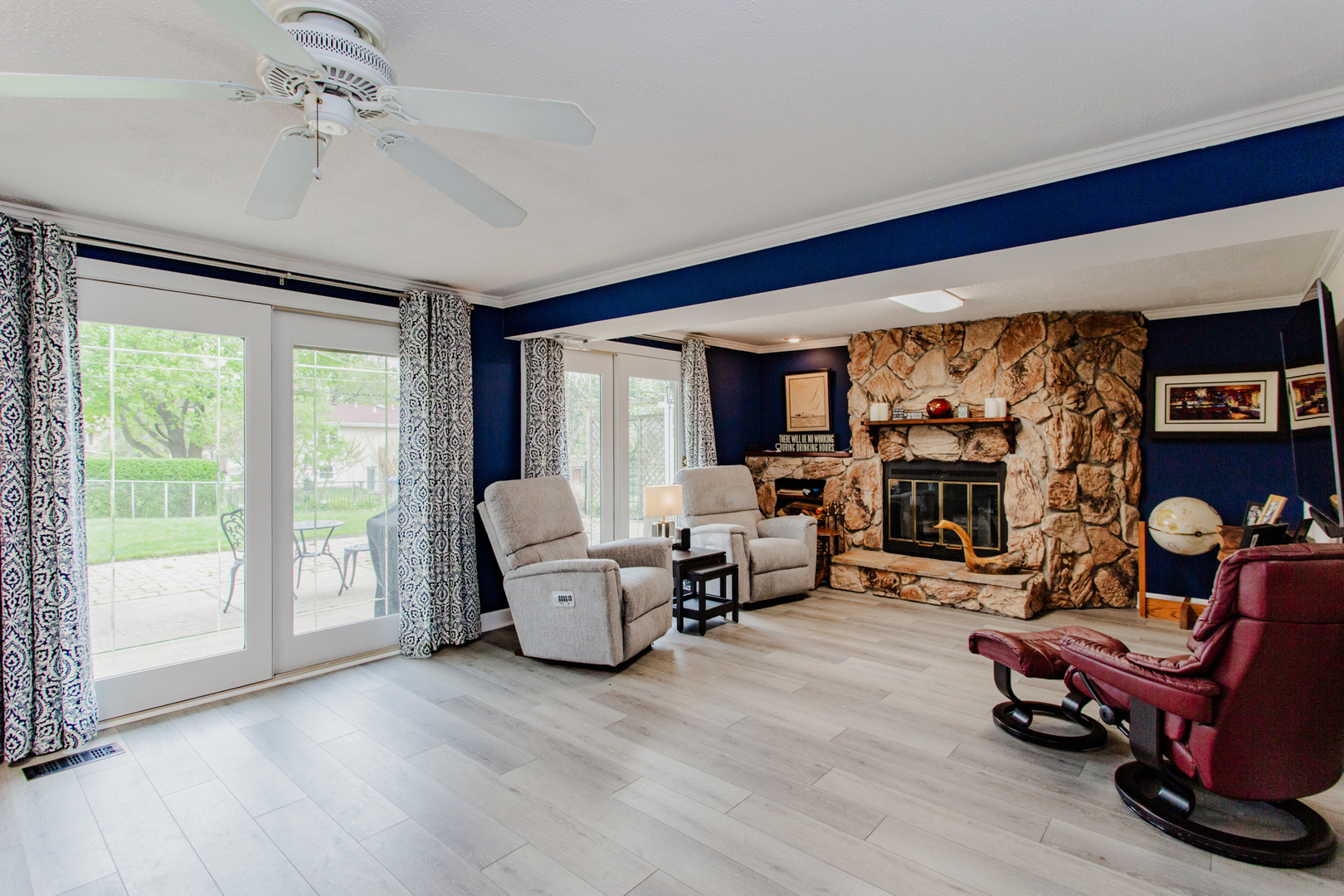 1685 Kent Road Hoffman Estates, IL 60169 - Photo 19 of 31 a living room with furniture and a fireplace