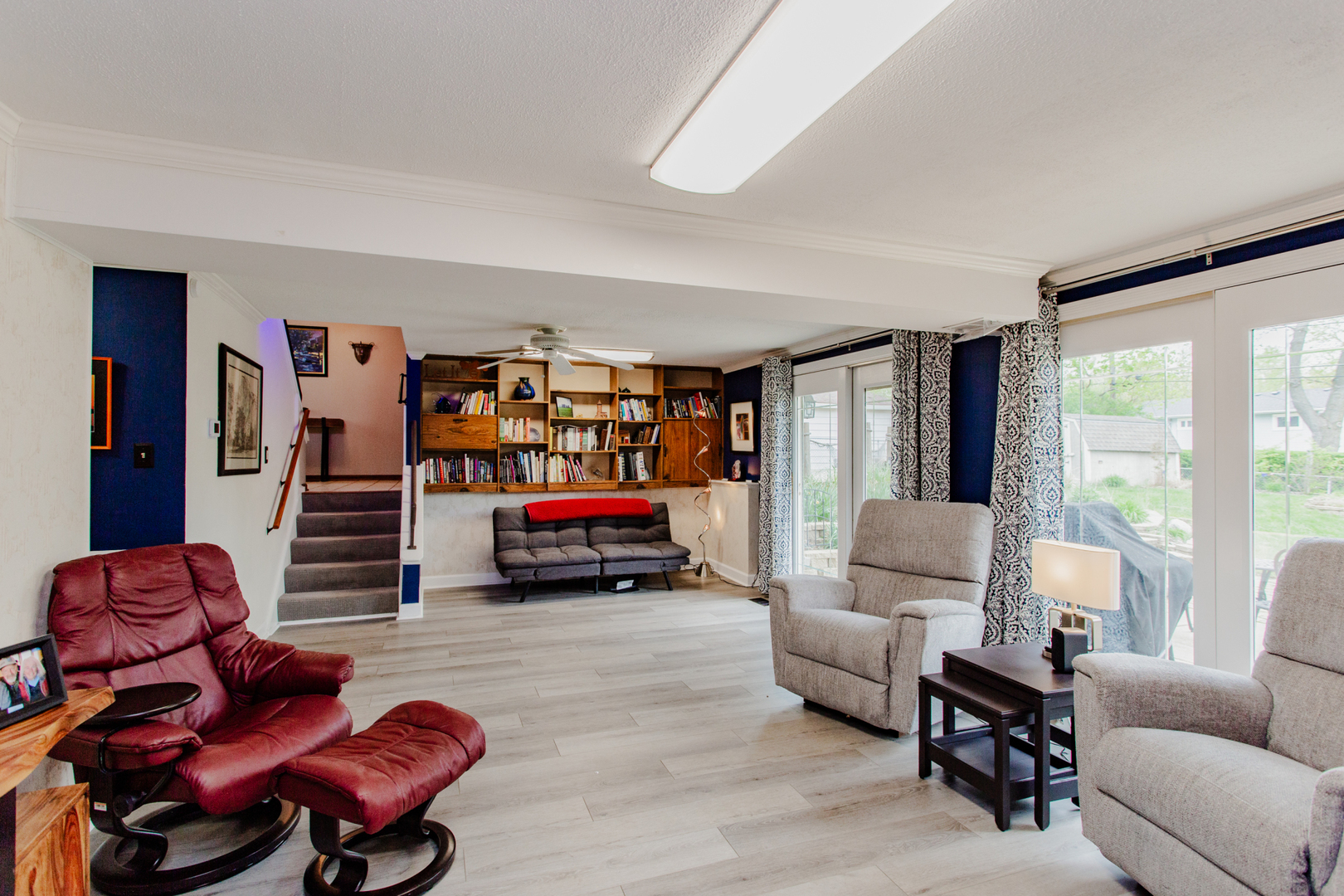 1685 Kent Road Hoffman Estates, IL 60169 - Photo 20 of 31 a living room with furniture a ceiling fan and a large window