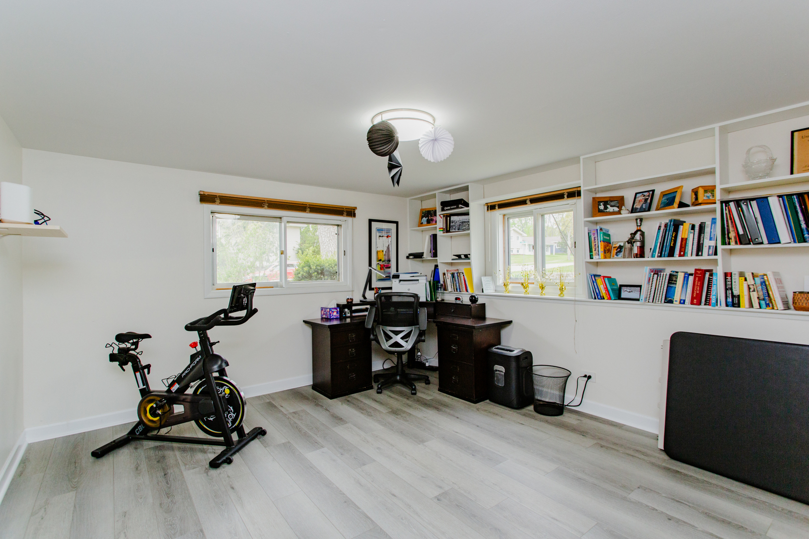 1685 Kent Road Hoffman Estates, IL 60169 - Photo 21 of 31 a room with furniture and a book shelf