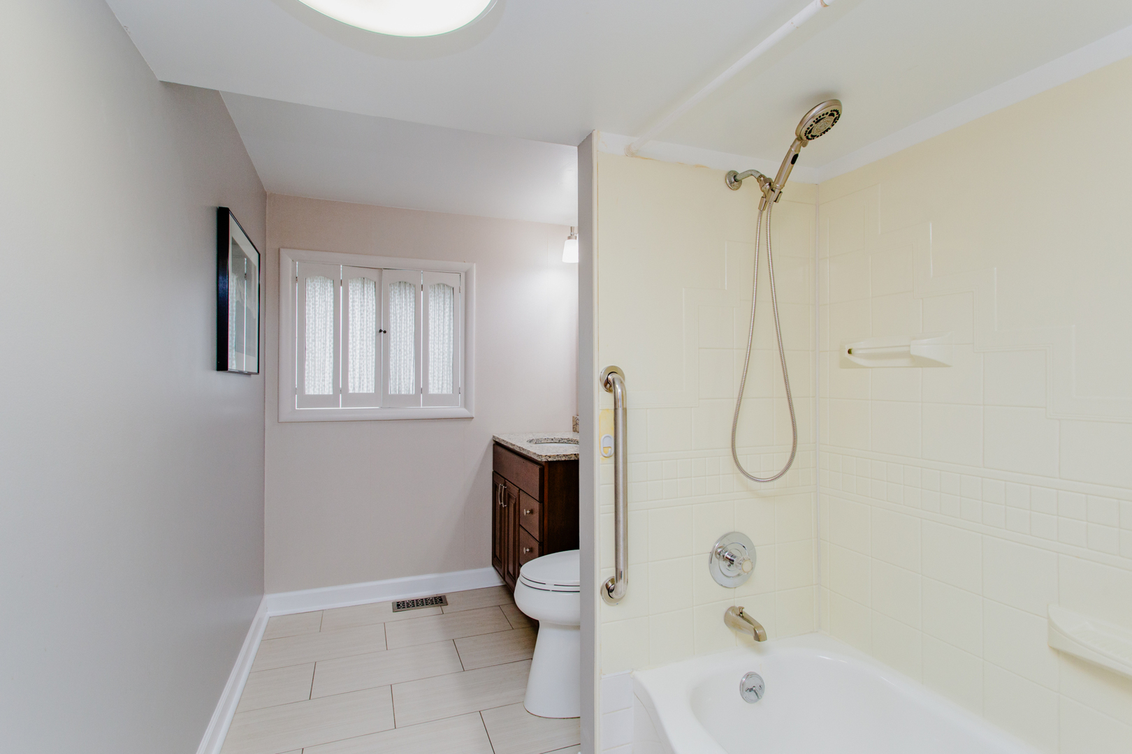 1685 Kent Road Hoffman Estates, IL 60169 - Photo 23 of 31 a bathroom with a toilet and a shower