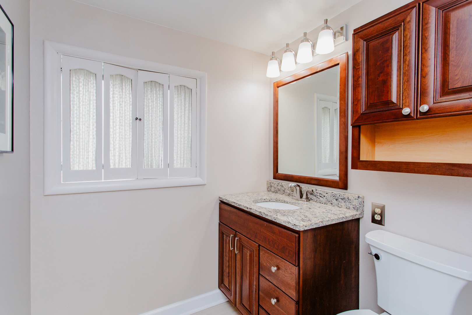 1685 Kent Road Hoffman Estates, IL 60169 - Photo 24 of 31 a bathroom with a sink double vanity and a mirror