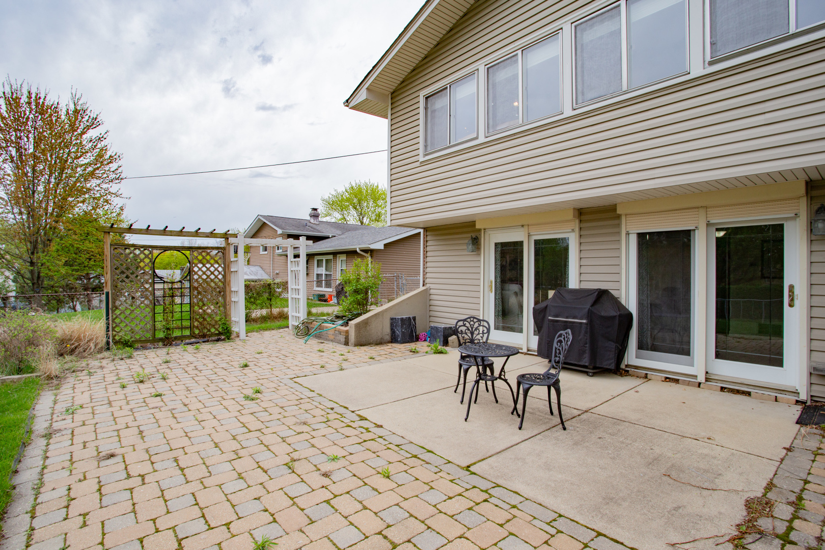 1685 Kent Road Hoffman Estates, IL 60169 - Photo 27 of 31 a view of a patio with table and chairs and a barbeque